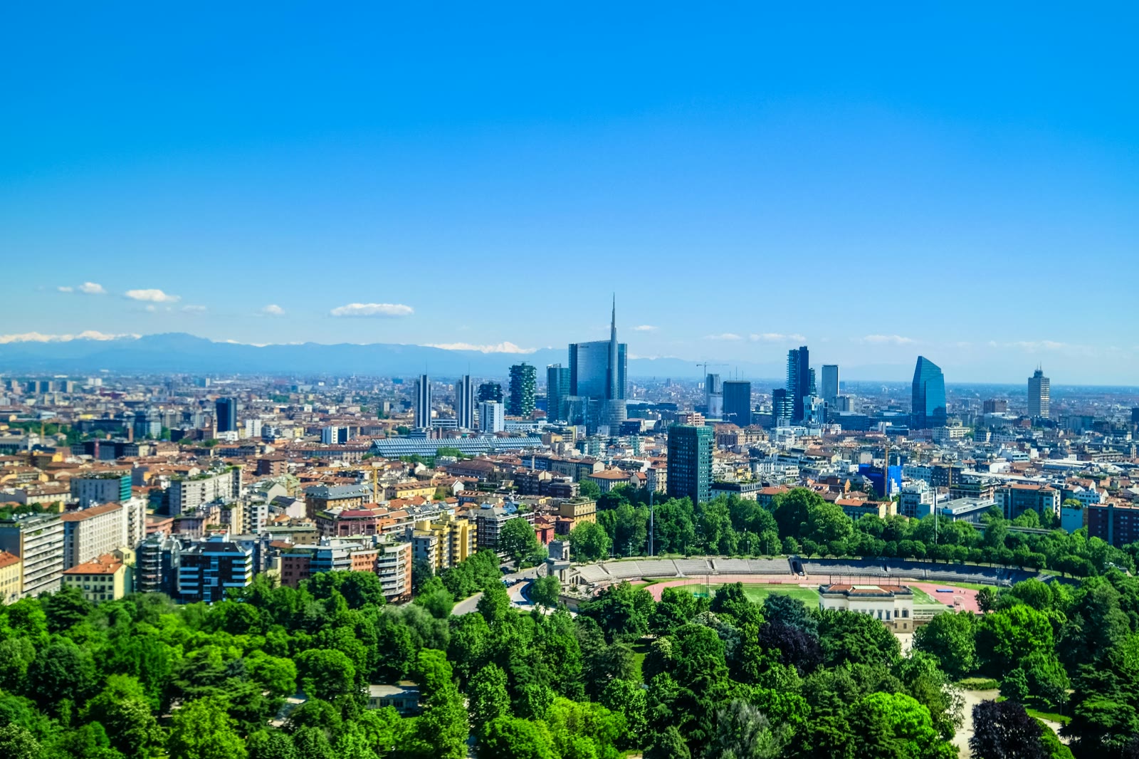 A city skyline seen across parkland